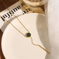 Black with gold chain pendant